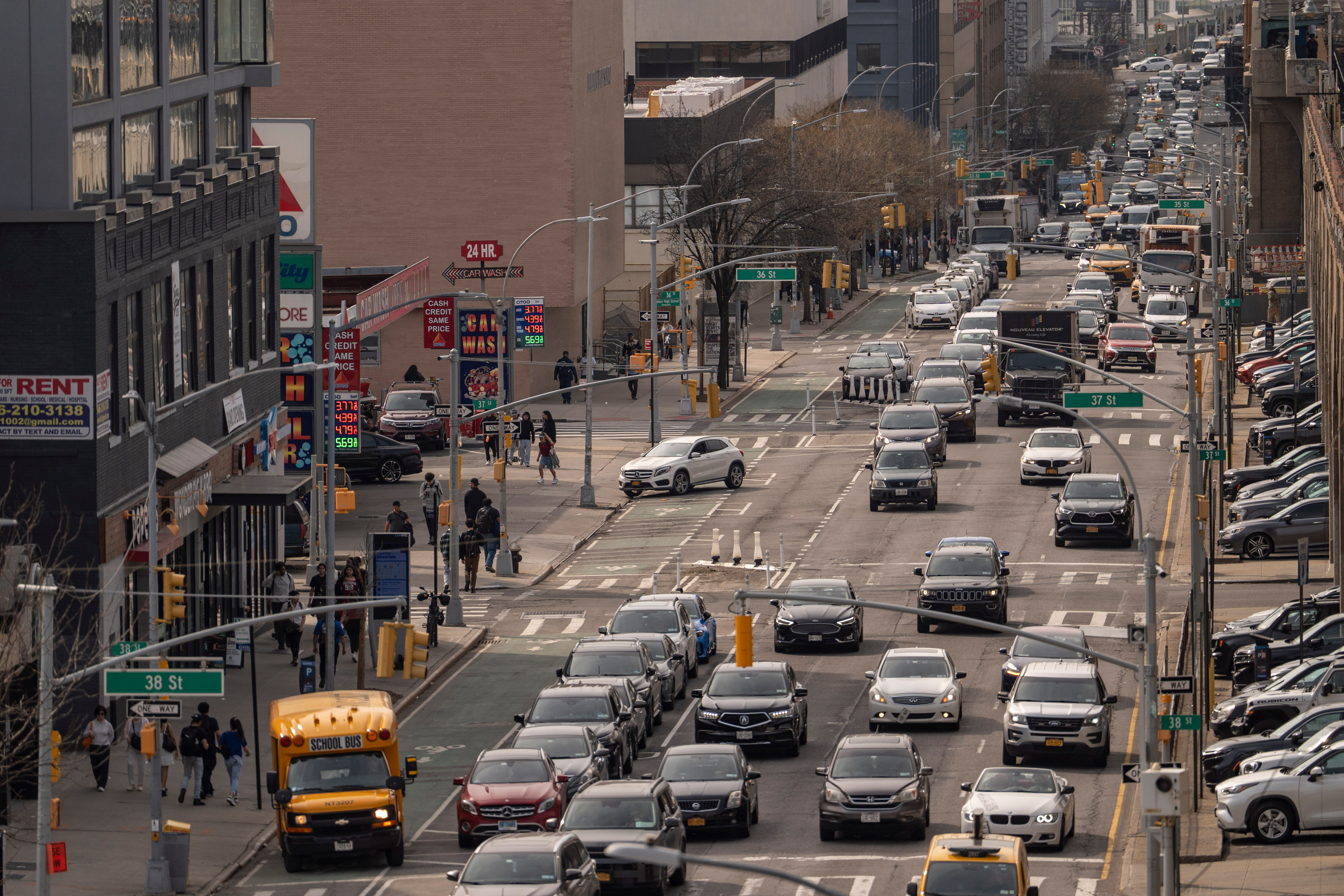 Vehicles drive past a CITGO gas station in the Queens borough of New York, Tuesday, March 31, 2026.