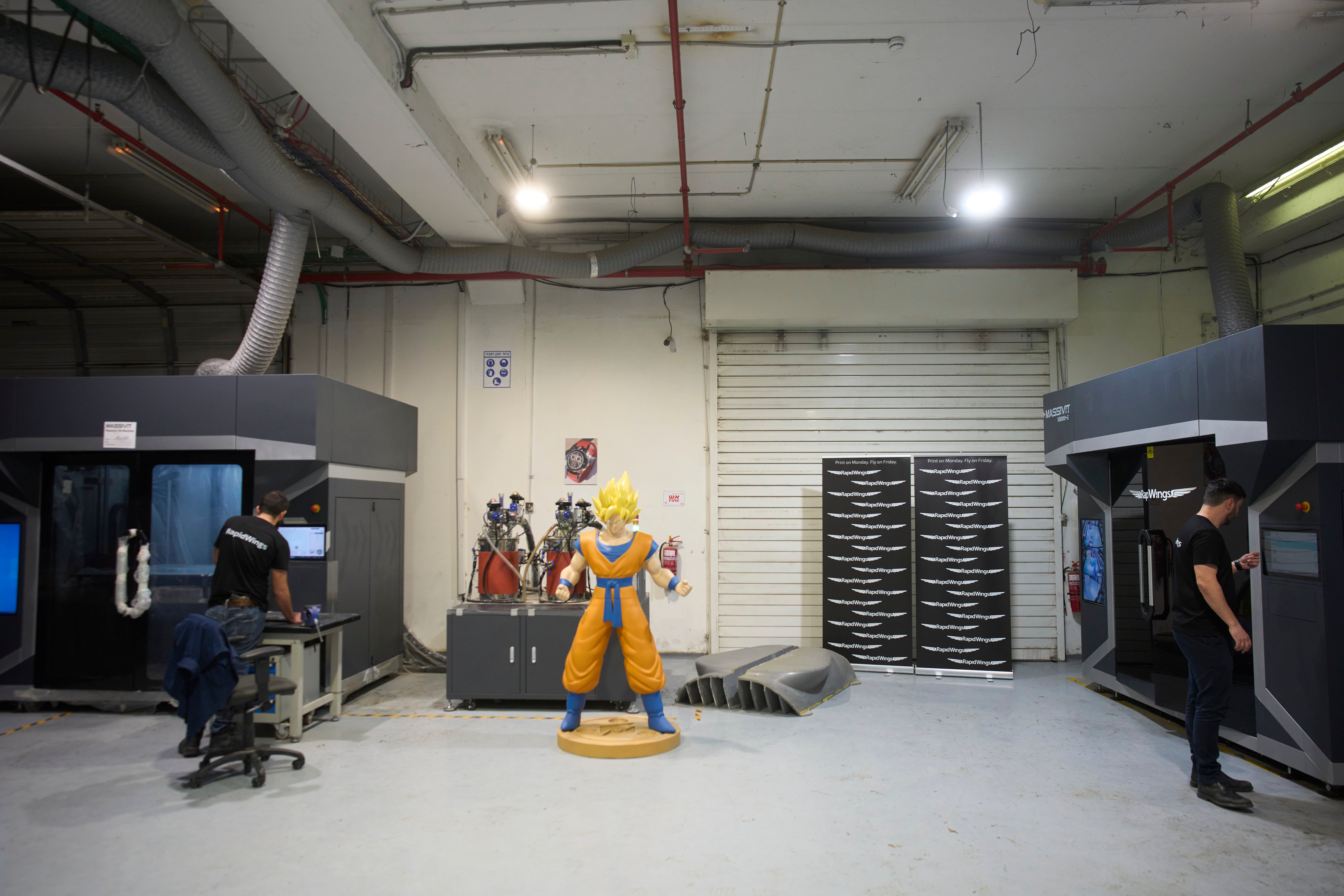 Workers operate a 3D printer that makes drone parts at the headquarters of Masssivit in Lod, Israel, March 30, 2026.