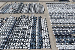 An aerial view of new cars awaiting export to oversea markets is seen at a port in Shanghai, March 10, 2026.