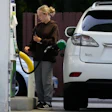 Customer checks gas price before she fills up her vehicle's tank at a gas station in Lincolnshire, Ill., Monday, June 8, 2026.