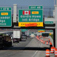 Exits from Interstate 75 are displayed for the Gordie Howe International Bridge and Ambassador Bridge connecting Windsor, Ontario, with Detroit, Tuesday, July 14, 2026,