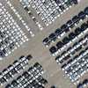An aerial view of new cars awaiting export to oversea markets is seen at a port in Shanghai, March 10, 2026.