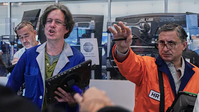 Options traders Justin Kanda, Doran Swan and Ravi Bhandari (left to right) work on the floor of the New York Stock Exchange, Thursday, June 25, 2026.