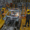 Workers assemble a car at the VinFast electric vehicle plant in Thoothukudi, in the southern Indian state of Tamil Nadu, Monday, Aug. 4, 2025.
