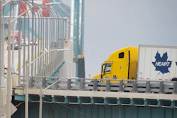 Transport trucks cross the Ambassador Bridge into the U.S. in Windsor, Ontario, Aug. 22, 2026.
