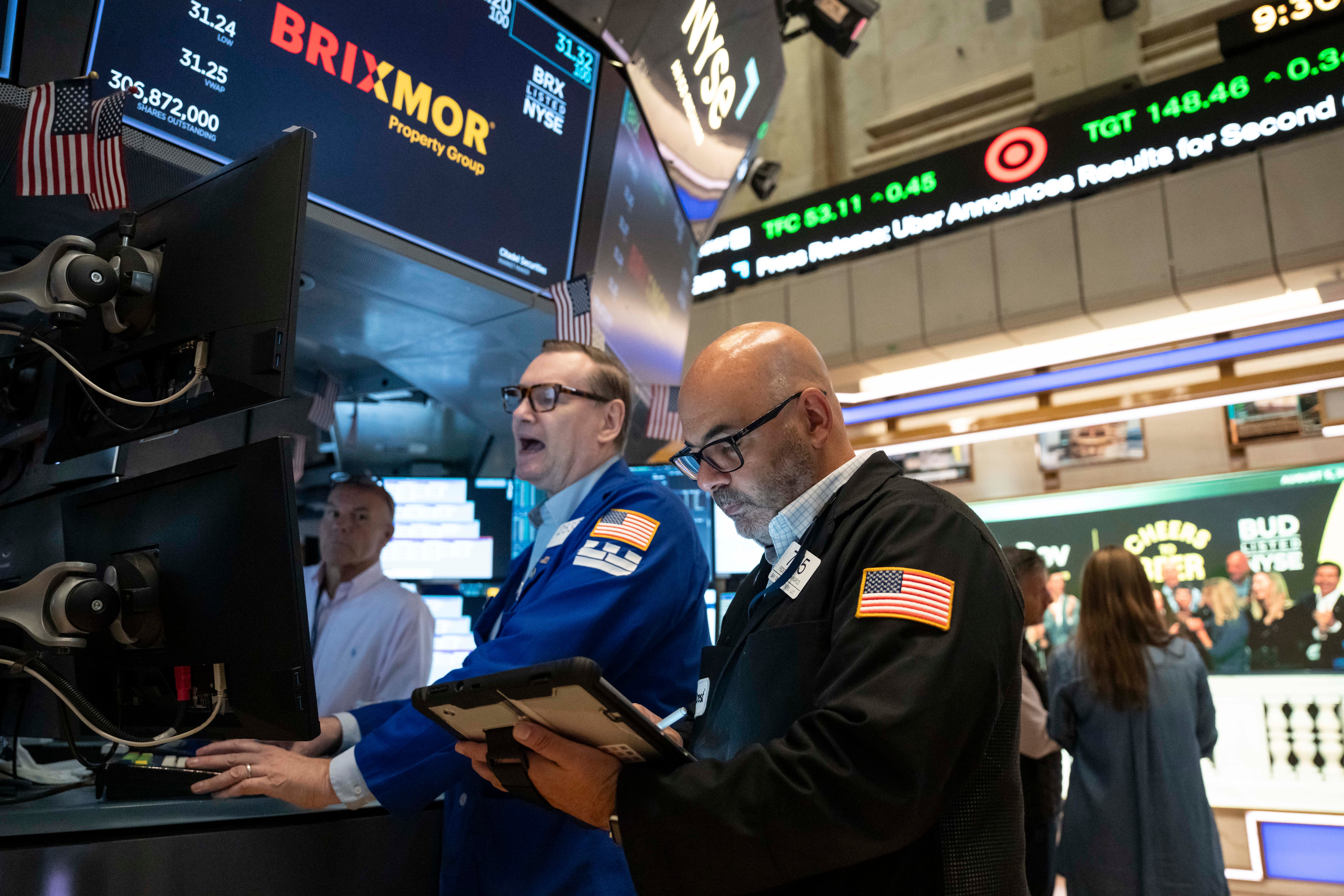 Trader Fred Demarco, right, and Specialist Patrick King, left, work on the floor of the New York Stock Exchange, Wednesday, Aug.. 5, 2026, in New York.