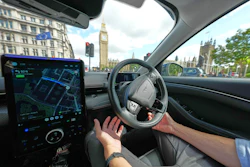 An Uber driver has his hands ready for intervention as he sits in an autonomous car in London, Tuesday, Sept. 1, 2026 as Uber officially launches the first hailable autonomous cabs in London.