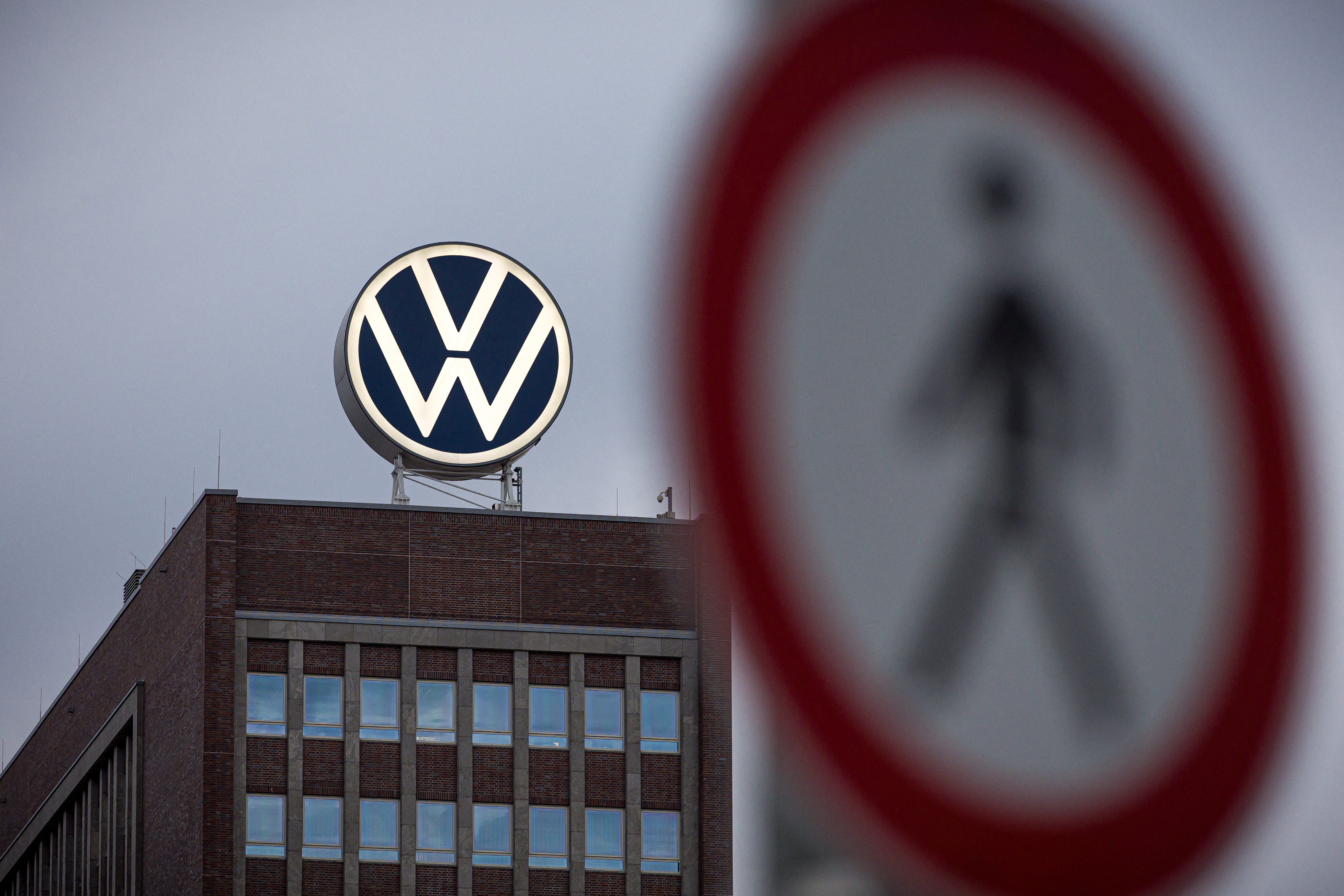 A view of a pedestrian traffic sign near to the Volkswagen brand skyscraper, in Wolfsburg, Germany, Friday, Sept. 4, 2026.