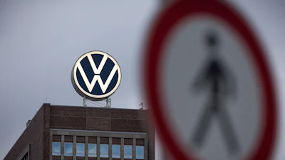 A view of a pedestrian traffic sign near to the Volkswagen brand skyscraper, in Wolfsburg, Germany, Friday, Sept. 4, 2026.