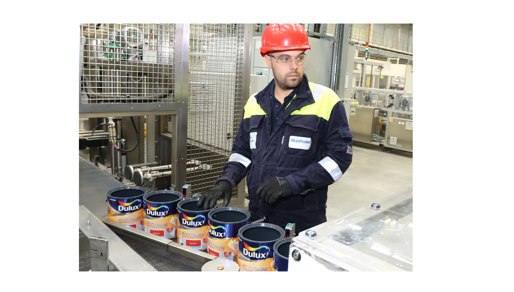 An AkzoNobel employee monitors Dulux Easycare paint production at the company's Ashington manufacturing site in the U.K.