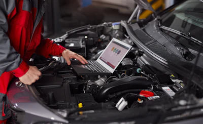Crop Mechanic Using Laptop During Car Diagnostics 2025 03 31 08 26 44 Utc