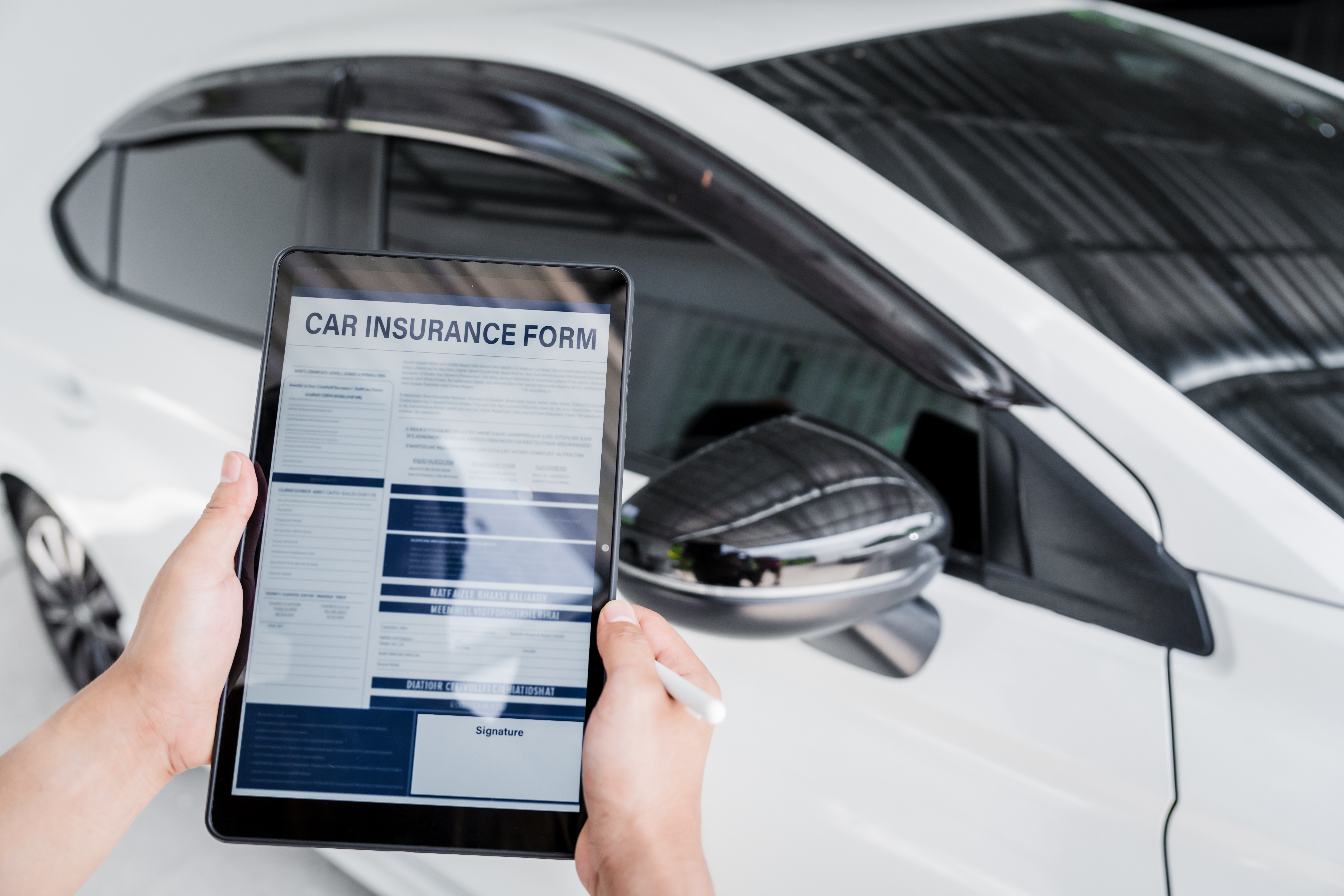 Man Fills Out A Car Insurance Form After A Car Acc 2025 03 09 01 49 15 Utc